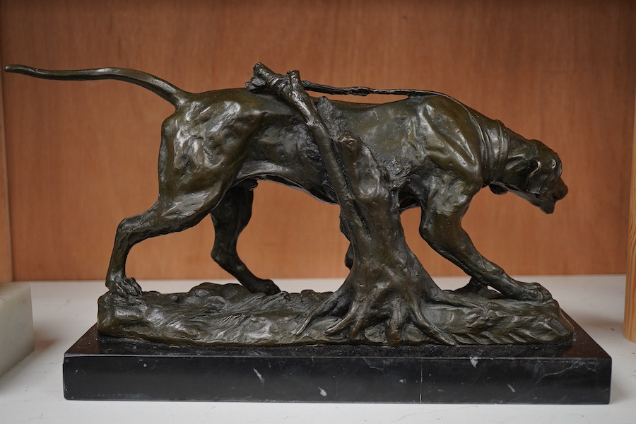A patinated bronze of a hunting dog, signed Coreira, on black marble base, 36cm wide